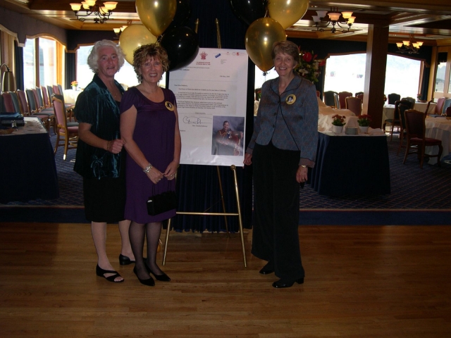 Madeline Kennedy, Linda Hay, and Sigrid Bjarnason with the Letter and photo from Charles, Prince of Wales