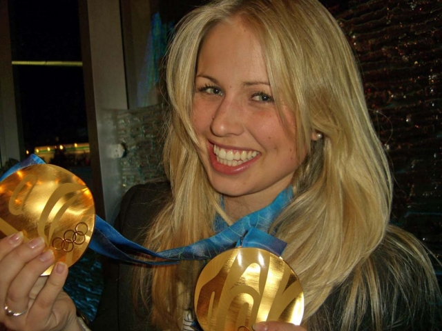 Mari Mathews with Ski Jumping Gold Medals